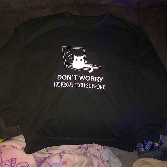 This is a Large womans sweatshirt from Shein. Black and white with blue pupils. - Picture 1 of 4